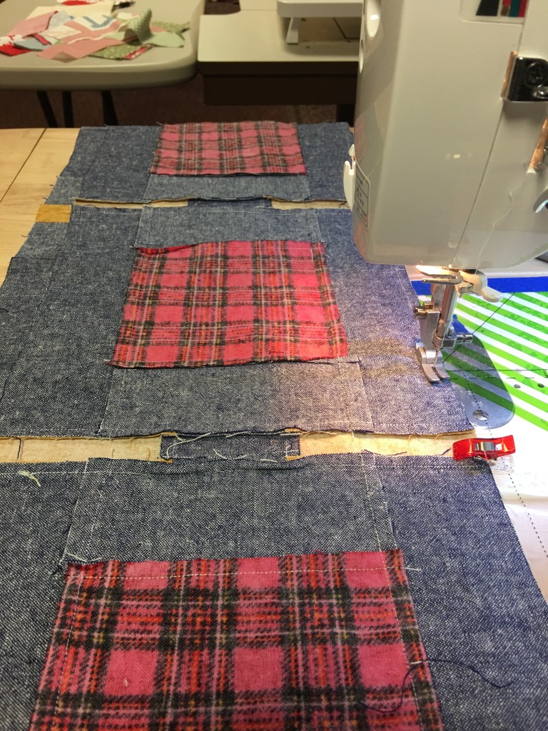 Sewing memory quilt squares together.