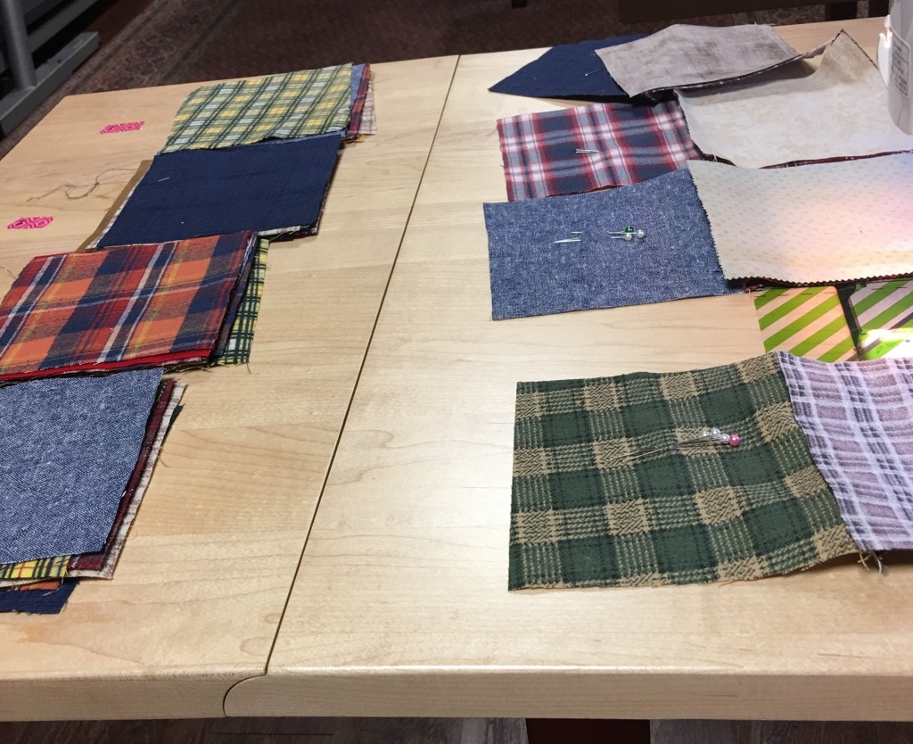 Sewing memory quilt squares together.